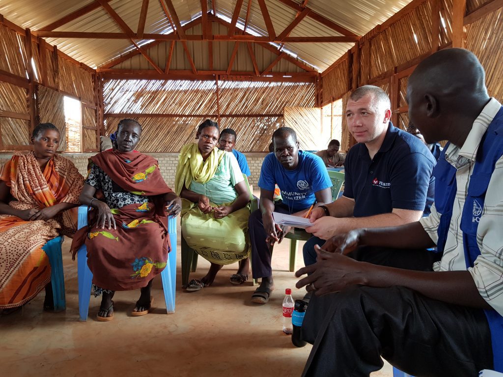 Fire Aid Charity - Firefighter talking with local community abroad